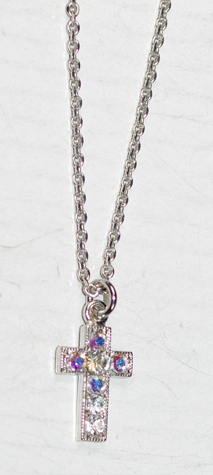 MARIANA CROSS PENDANT WINDS OF CHANGE: clear, a/b stones in 1/2" silver rhodium setting, 18" adjustable chain