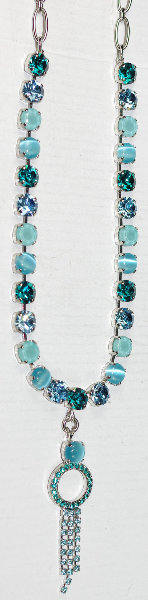 MARIANA NECKLACE ADDICTED TO LOVE: teal, blue stones in silver rhodium setting, 2" long charm, 17" adjustable chain