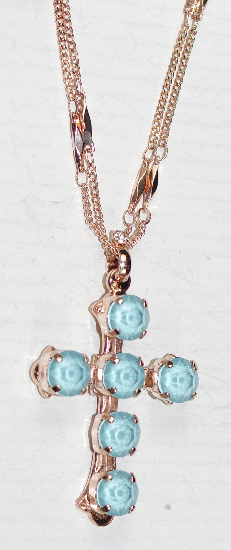 MARIANA CROSS PENDANT ELECTRIC BLUE: blue stones in rose gold setting, 18" double chain