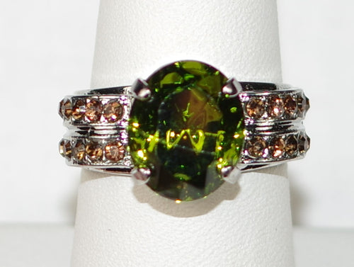 MARIANA RING EVERGREEN: green, amber stones, center stone 1/2" silver rhodium setting, adjustable band