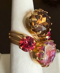 MARIANA RING: red, pink, brown stones in 1.25" yellow gold setting, adjustable size band