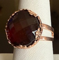 MARIANA RING RED: dark red stone in 3/4" rose gold setting, adjustable size band