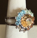 MARIANA RING FORGET ME NOT: blue, amber, green stones in 3/4" silver rhodium setting, adjustable size band