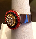 MARIANA RING MAGIC: orange, black, amber stones in 5/8" rose gold setting, adjustable size band