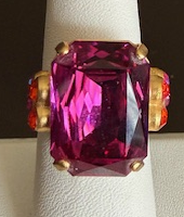MARIANA RING RAINBOW SHERBERT: 3/4" fuschia emerald cut stone, with orange and pink, yellow gold setting, adjustable band