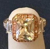 STERLING SILVER CZ RING WITH ROSEGOLD TRIM SIZE 6