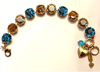 MARIANA BRACELET FIRST TOAST: amber, blue, light brown 1/2" stones in yellow gold setting
