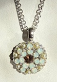 MARIANA ANGEL PENDANT CHAMPAGNE & CAVIAR: amber center, pearl and white stones in silver rhodium setting, 18" adjustable chain