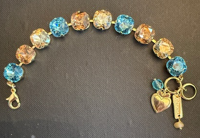 MARIANA BRACELET FIRST TOAST: amber, blue, light brown 1/2" stones in yellow gold setting
