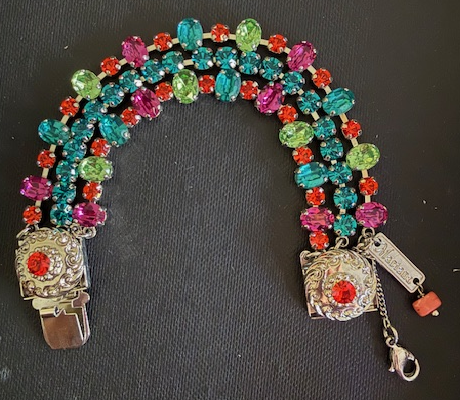 MARIANA BRACELET RAINBOW SHERBERT: three strands, blue, green, orange, pink stones in silver rhodium setting, safety chain