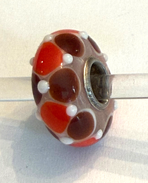 TROLLBEAD UNIVERSAL UNIQUE ORANGE, BROWN WITH WHITE DOTS BEAD