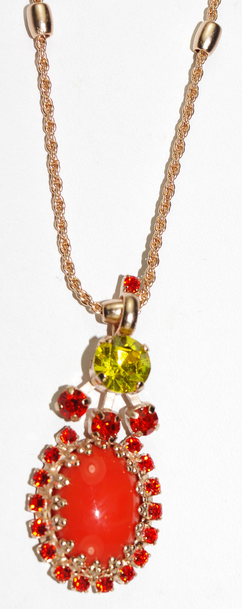 MARIANA PENDANT STRENGTH: orange, green stones, pendant = 1.5", in rose gold setting, 20" adjustable chain