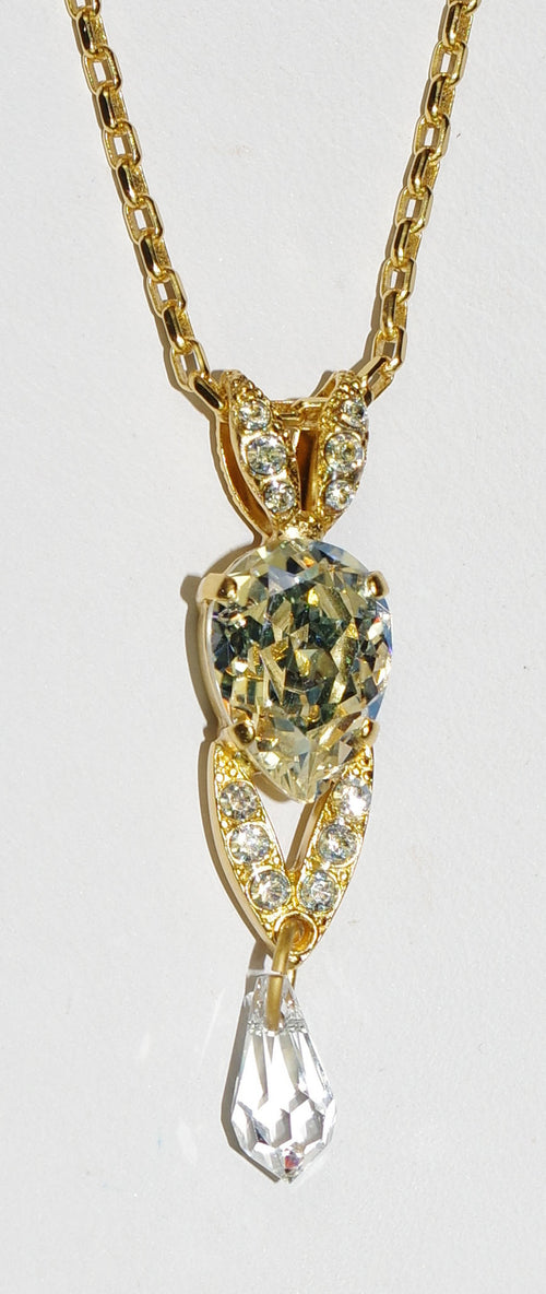 MARIANA PENDANT ON A CLEAR DAY: clear stones in yellow gold setting, 1.5" pendant, 18" adjustable chain