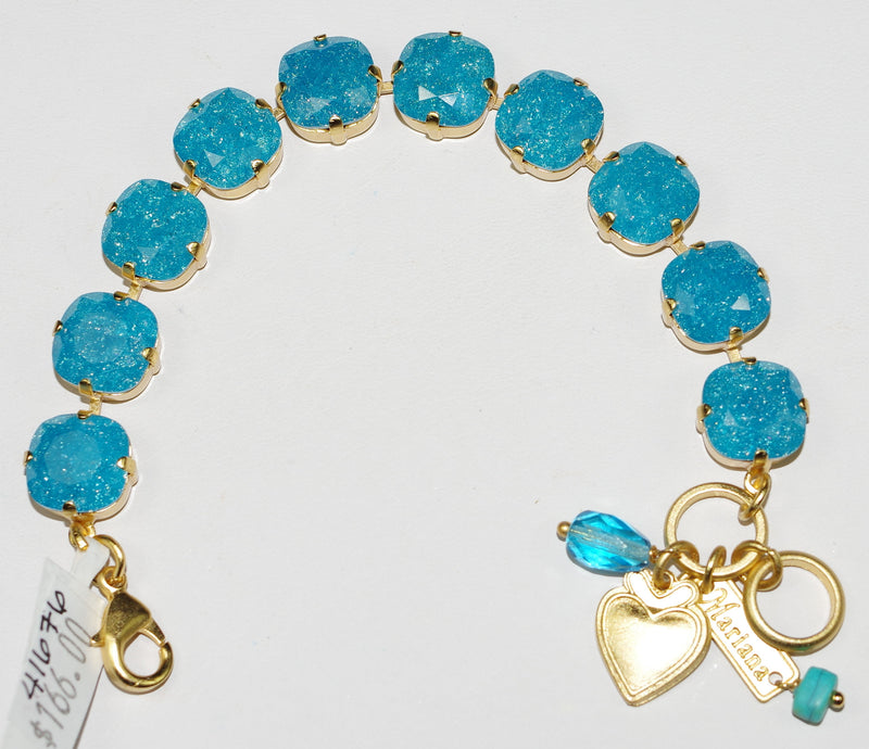 MARIANA BRACELET BLUE ZIRCON: 1/2" blue stones in yellow gold setting
