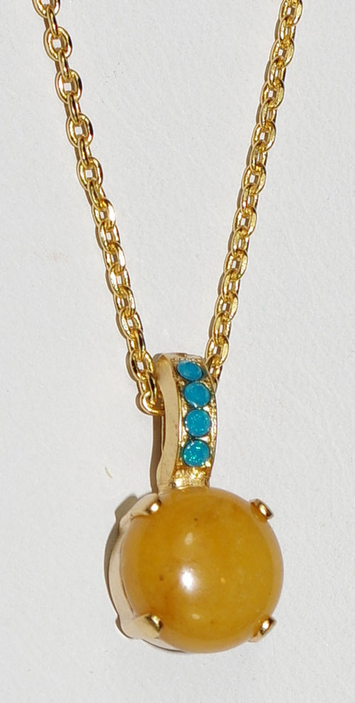 MARIANA PENDANT KOKOMO: tan mineral, blue stones in 3/4" yellow gold setting, 18" adjustable chain