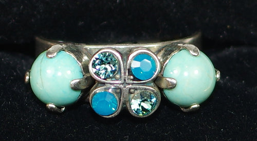 MARIANA RING ZAMBEZI: blue stones, center stone = 3/8" in silver setting, adjustable size band