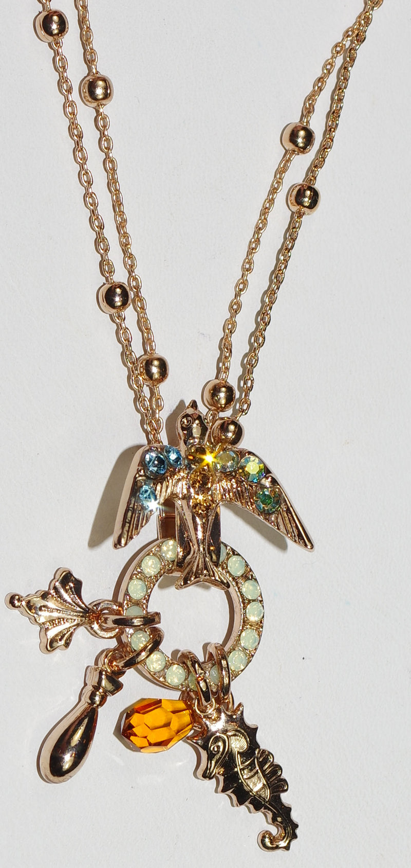 MARIANA PENDANT FORGET ME NOT: green, blue, a/b, amber stones in 2" rose gold setting, 18" adjustable double chain