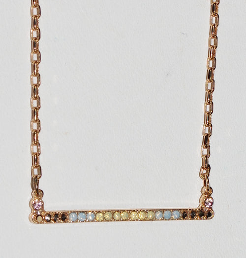 MARIANA  PENDANT RHAPSODE: blue, yellow, gold stones, in 1.5" rose gold setting, 18" adjustable chain
