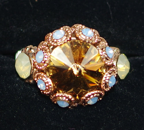 MARIANA RING RHAPSODE XOXO: amber, blue, white stones in 3/4" rose gold setting, adjustable size band
