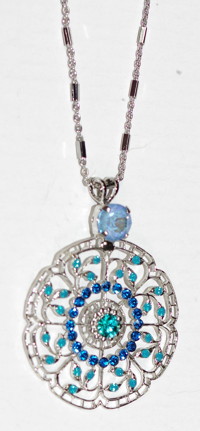 MARIANA PENDANT SERENITY: blue, teal stones in 2" silver rhodium setting, 32" adjustable chain