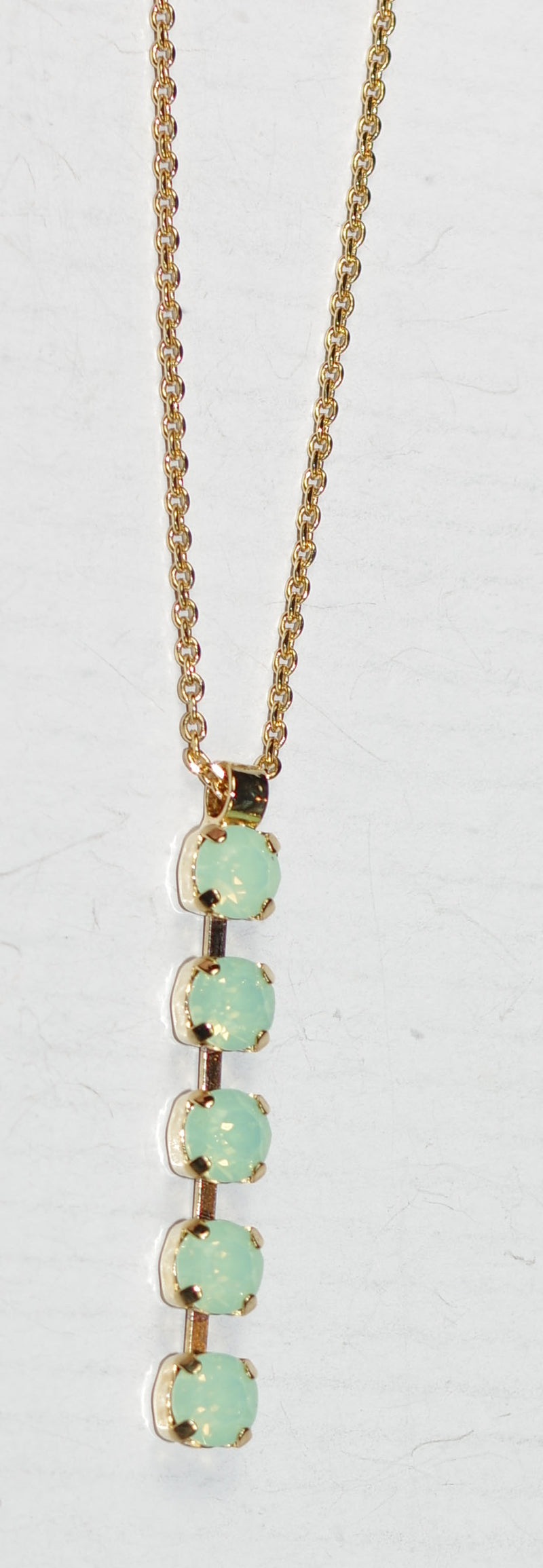 MARIANA PENDANT: green stones in 2" yellow gold setting, 19" adjustable chain