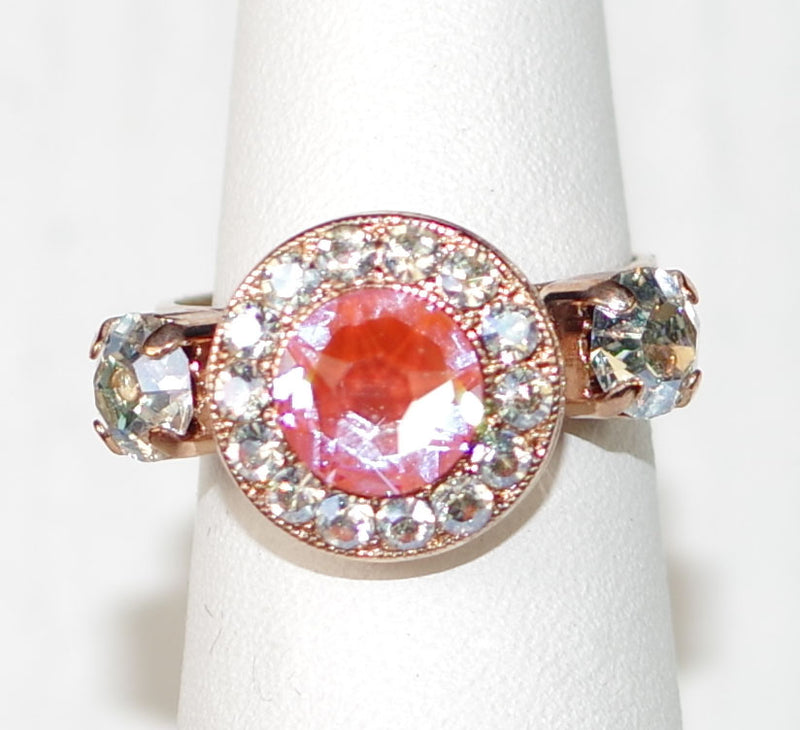 MARIANA RING: pink sun kissed, clear stones, center stone = 1/2" in rose gold setting, adjustable size band